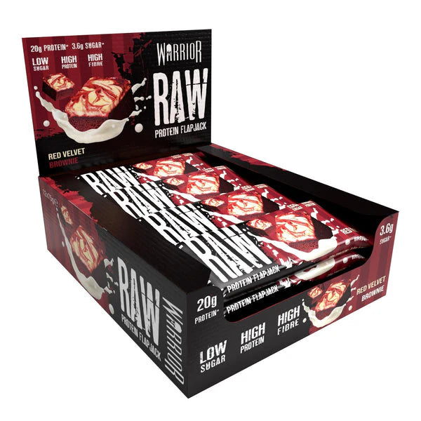 Warrior RAW Bar display box showcasing Red Velvet Brownie protein flapjacks, each bar offers 20g protein, low sugar, and high fiber, ideal for fitness and recovery.