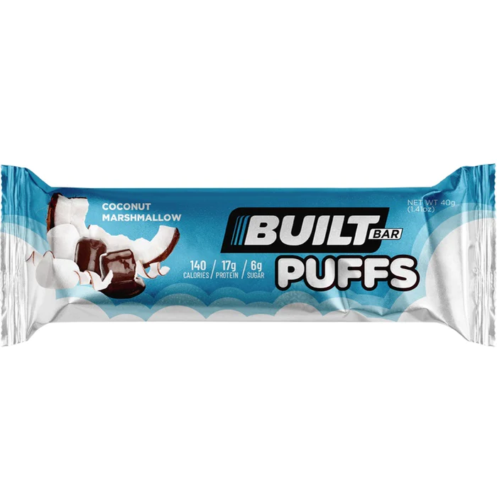 Built Puffs candy bar, a protein-infused marshmallow snack, offering a healthier churro and banana cream pie flavor, aligning with fitness supplement standards.