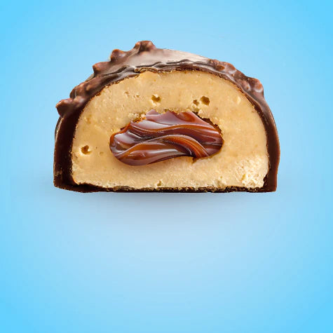 SNCK Protein Bar cross-section showing a milk-chocolate shell with peanut butter filling and caramel core, designed to taste like candy while providing protein.