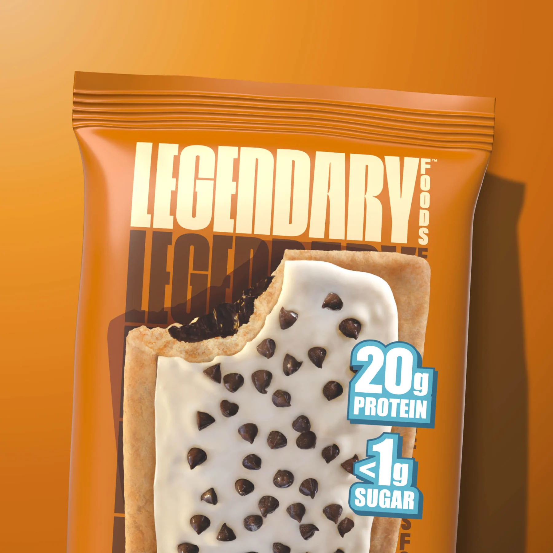 Legendary Foods Tasty Pastry, a protein-rich snack resembling a chocolate chip cookie with white frosting, ideal for fitness enthusiasts seeking a quick, nutritious treat.